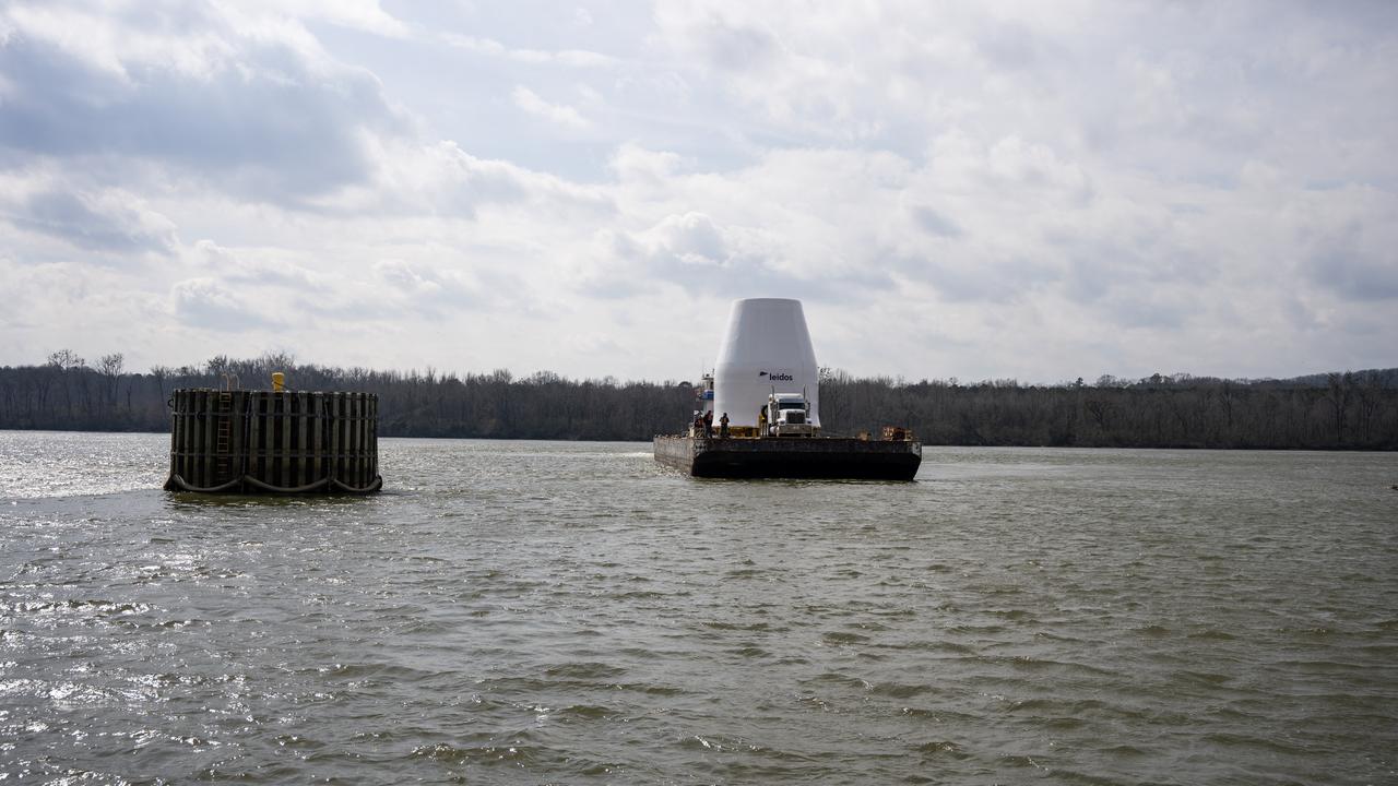 These photos and videos show how crews guided a test version of the universal stage adapter for NASA’s more powerful version of its SLS (Space Launch System) rocket to Building 4619 at the agency’s Marshall Space Flight Center in Huntsville, Alabama, Feb. 22. Built by Leidos, the lead contractor for the universal stage adapter, crews transported the hardware from a Leidos facility in Decatur, Alabama, the same day. The universal stage adapter will connect the SLS rocket’s upgraded in-space propulsion stage, called the exploration upper stage, to NASA’s Orion spacecraft as part of the evolved Block 1B configuration of the SLS rocket. It will also serve as a compartment capable of accommodating large payloads, such as modules or other exploration spacecraft. In Building 4619’s Load Test Annex High Bay at Marshall, the development test article will first undergo modal testing that will shake the hardware to validate dynamic models. Later, during ultimate load testing, force will be applied vertically and to the sides of the hardware. Unlike the flight hardware, the development test article has flaws intentionally included in its design, which will help engineers verity that the flight adapter can withstand the extreme forces it will face during launch and flight.